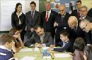 Los Reyes, Felipe VI y Letizia, acompañados por el ministro de Educación, José Ignacio Wert (2d) y otras autoridades locales en un aula del centro Ben-Cho-Shey. EFE