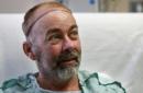 In this photo taken on Wednesday, June 3, 2015, transplant patient Jim Boysen sits in his hospital bed at Houston Methodist Hospital in Houston. Texas doctors say they have done the world's first partial skull and scalp transplant to help Boysen with a large head wound from cancer treatment. MD Anderson Cancer Center and Houston Methodist Hospital doctors announced Thursday, June 4 that they did the operation on May 22 at Houston Methodist. (Mayra Beltran/Houston Chronicle via AP)