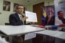 El ministro de Salud de Venezuela, Henry Ventura, muestra una tabla mientras habla con Reuters durante una entrevista en su oficina en Caracas